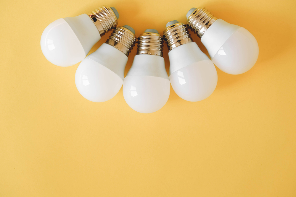 Led,Light,Bulbs,On,Yellow,Background.,Top,View.,Copy,,Empty