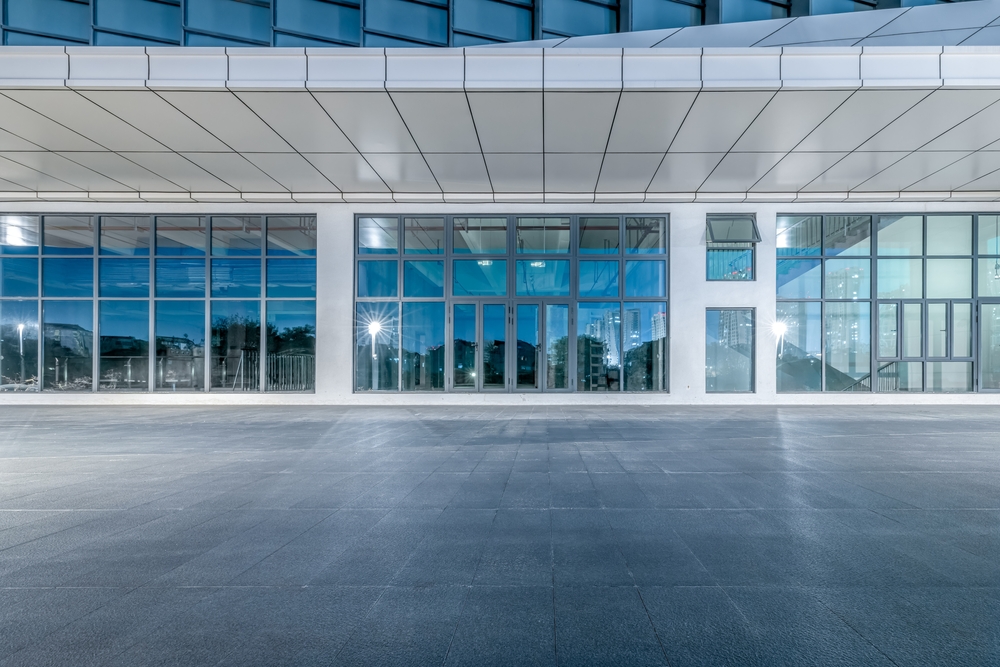 Empty,Brick,Floor,And,Commercial,Building,Background